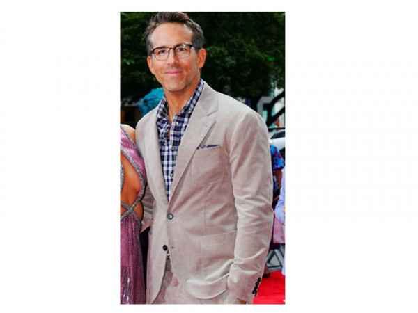 Ryan Reynolds in beige jacket and check shirt
